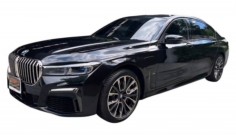 BMW luxury car 2 people, 2 suitcases,
