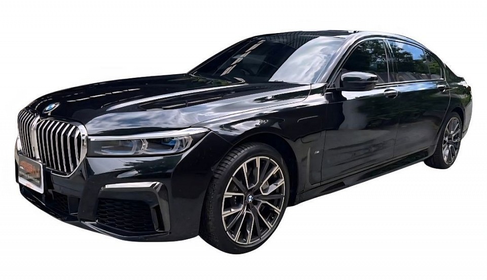 BMW luxury car 2 people, 2 suitcases,