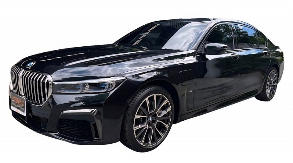 BMW luxury car 2 people, 2 suitcases,